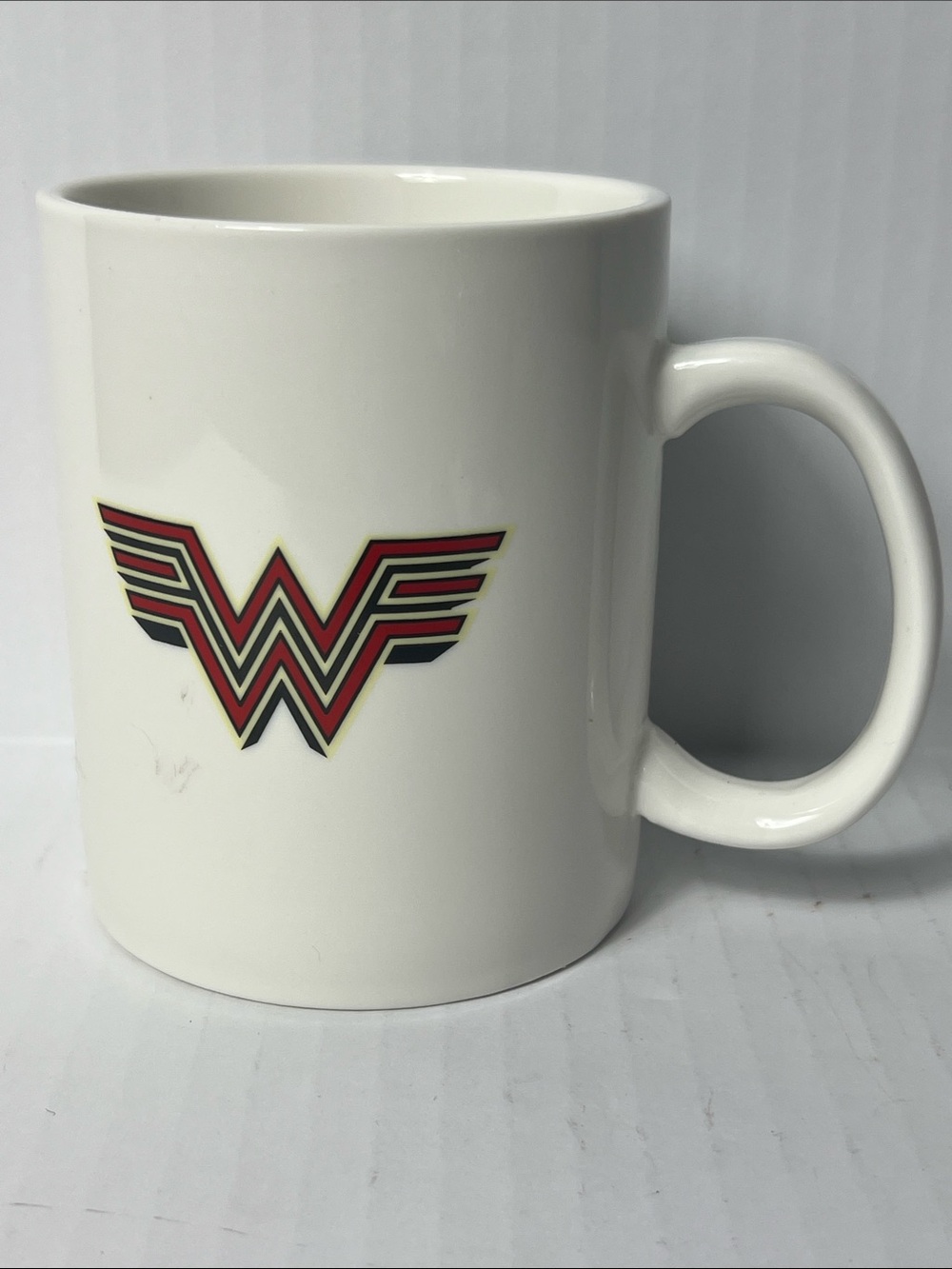 Wonder Woman Emblem White Ceramic Mug with Red and Black Accent - Home Accents